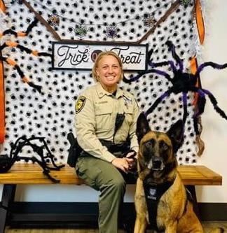 Dawn Bonito — graduate with Malinois at Halloween event