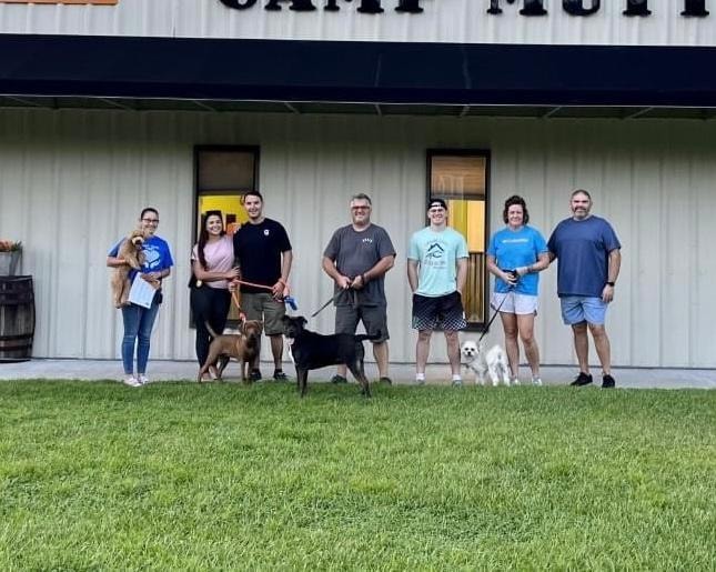 Group graduation photo outside Camp Mutt