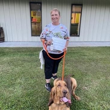 Bloodhound graduate with owner