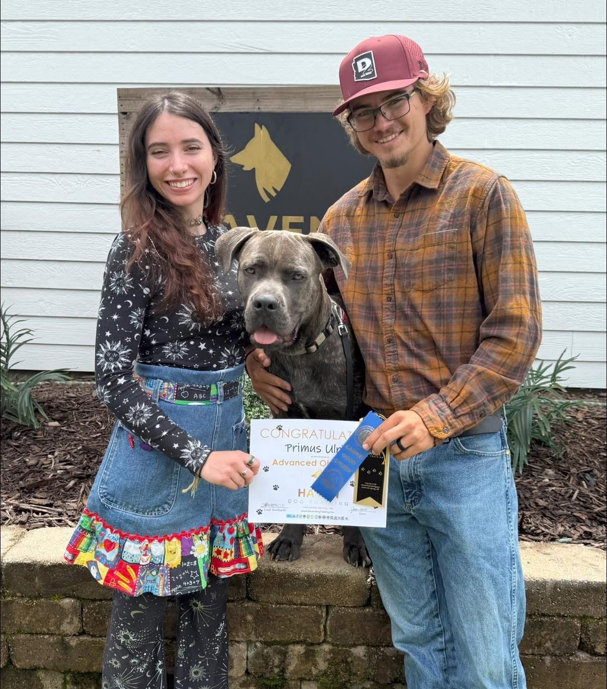 Primus — couple holding graduation certificate with dog at Haven banner