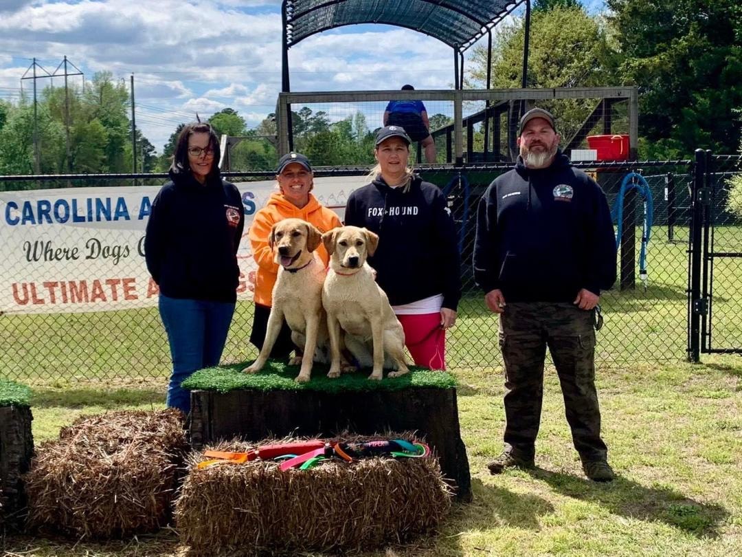 Yeti and Piper with team at Carolina Agility dog sports event